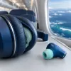 Over-ear or earbuds for your next flight: how carry-on space, sleep and cabin pressure change the answer