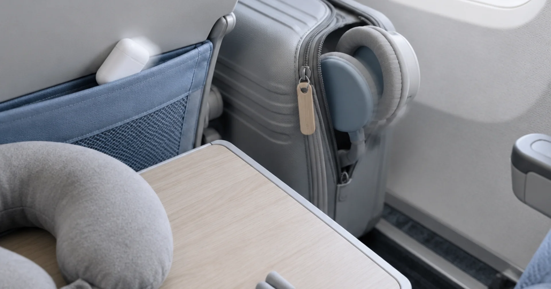 Over-ear or earbuds for your next flight: how carry-on space, sleep and cabin pressure change the answer
